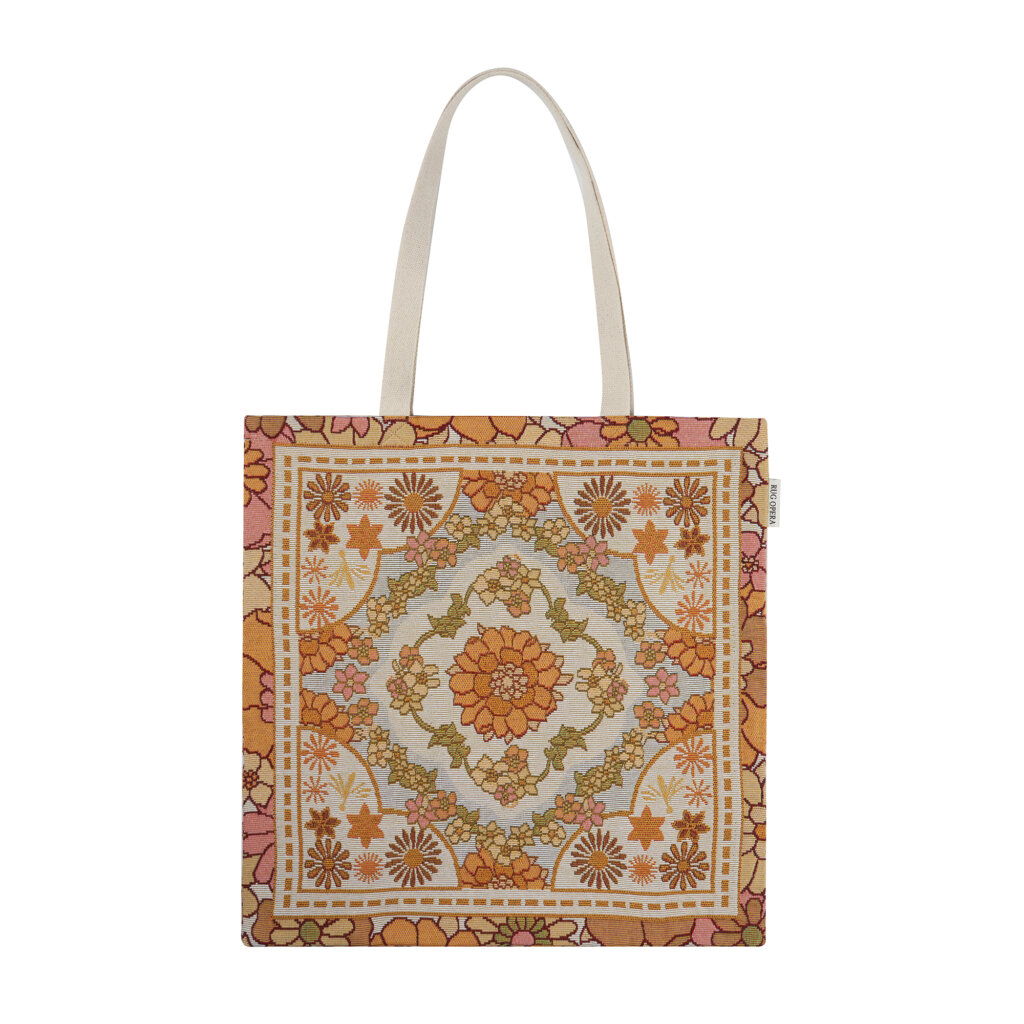 Premium woven tapestry tote bag featuring the Marigold Sonata design with a vintage symmetrical floral motif in warm amber and terracotta tones.
